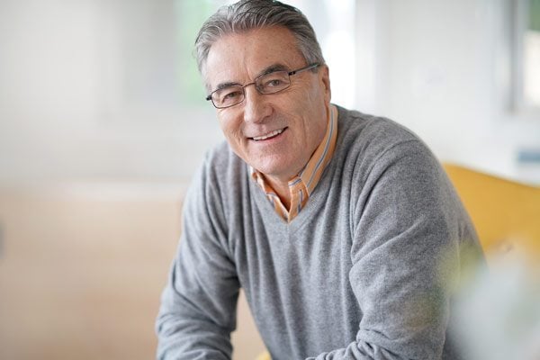 man considering if he should visit a Oral Maxillofacial surgeon near me